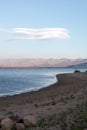 Lenticular cloud hovering above drought stricken Lake Isabella in the southern range of California's Sierra Nevada mountains