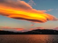 Lenticular Clouds Over a Lake at Sunset Royalty Free Stock Photo