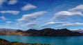 Lenticular clouds over a lake at the Torres del Paine hike in Patagonia, Chile. Royalty Free Stock Photo