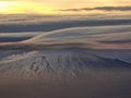 Lenticular clouds over mountain Royalty Free Stock Photo