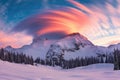 lenticular clouds over a mountain ridge during a vibrant sunrise