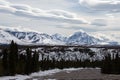 Lenticular clouds over snowcapped mountains in the spring in Denali National Park in Alaska USA Royalty Free Stock Photo