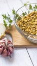 Lentil bowl with water next to onion and garlic