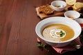 Lentil cream soup in a bowl with spices turmeric, paprika and garlic