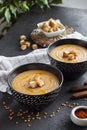 Lentil cream soup with paprika and crouton in black ceramic bowls Royalty Free Stock Photo