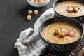 Lentil cream soup with paprika and crouton in black ceramic bowls Royalty Free Stock Photo
