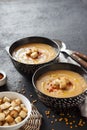 Lentil cream soup with paprika and crouton in black ceramic bowls Royalty Free Stock Photo