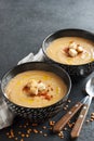 Lentil cream soup with paprika and crouton in black ceramic bowls Royalty Free Stock Photo