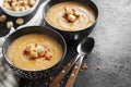 Lentil cream soup with paprika and crouton in black ceramic bowls Royalty Free Stock Photo