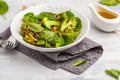 Lentil curry salad with broccoli and avocado on white background