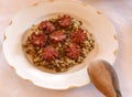 Lentil, hulled grain and sausage.