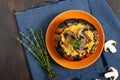 Lentil porridge with mushrooms in a pumpkin pot. Dietary, lean menu. Vegetarian dish. Top view Royalty Free Stock Photo