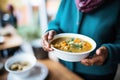 lentil soup being served at a community dinner