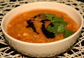 Detail of dense Lentil soup with tomatoes and carrot