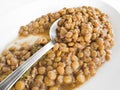 Lentil soup with spoon on white dish. Royalty Free Stock Photo