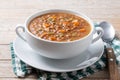 Lentil soup with vegetables in bowl on wood Royalty Free Stock Photo