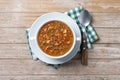 Lentil soup with vegetables in bowl on wooden table Royalty Free Stock Photo