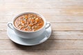 Lentil soup with vegetables in bowl on wooden table Royalty Free Stock Photo