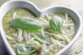 Lentil soup in white heart shaped bowl