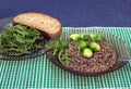 Lentils, broccoli and arugula salad leaves with grain bread on a plates