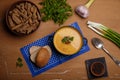 Lentils or pea soup-puree with parsley, onions, garlic barn bread and rye crackers on wooden rustic table. Organic healthy food Royalty Free Stock Photo