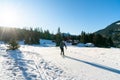 Caucasian woman in her thirties enjoys a nordic skiing workout in winter