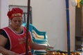 Leon, Nicaragua - March 10,2018: Nicaraguan woman cooking on the street typical food