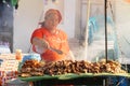 Leon, Nicaragua - March 10,2018: Nicaraguan woman cooking on the street typical food