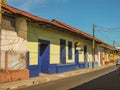 Single story painted houses in street , Leon, Nicaragua