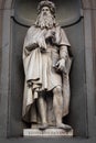 Leonardo da Vinci - Statue of the genius, located in front of Uffizi Gallery in Florence, Italy, in public area Royalty Free Stock Photo