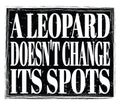 A LEOPARD DOESN`T CHANGE ITS SPOTS, text on black stamp sign Royalty Free Stock Photo