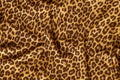 Leopard effect, fabric pattern, background sample. Leopard print seamless background. Royalty Free Stock Photo