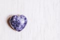 Lilac lepidolite stone heart on white background Royalty Free Stock Photo