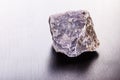 Lepidolite stone on wood Royalty Free Stock Photo