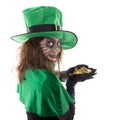 Leprechaun girl holding a gold treasure, concept st. patrickÃÂ´s