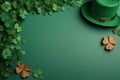 Leprechaun hat and decorative clover leaves on green background