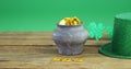Leprechauns pot of gold and hat on table for st patricks