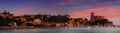 LERICI, LIGURIA, ITALY Ã¢â¬â JUNE 24, 2019: Panorama landscape view with boats, sea and old castle against great sunset Royalty Free Stock Photo