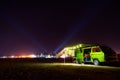 Lerissos, Greece, 25/06/2019: Young girl lying inside of an old timer camper van parked on the beach with decorative lanterns and