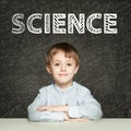 Lern Science. Clever student child on blackboard background with maths formulas Royalty Free Stock Photo