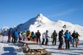 Skiers are standing on top of mountain in Alpine resort