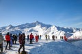 Skiers on top of mountain in Alpine resort