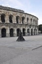 Les Arenes old Roman Amphitheater with Matador statue front of from Nimes France Royalty Free Stock Photo