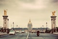 Les Invalides seen from Pont Alexandre III bridge in Paris, France. Vintage Royalty Free Stock Photo