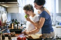 Lesbian couple cooking in the kitchen together Royalty Free Stock Photo