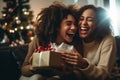 lesbian couple giving gifts and presents to each other, female gay lgbt homosexual african american marriage or black girlfriends