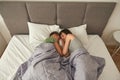 Lesbian couple lay and sleep under blanket on bed Royalty Free Stock Photo