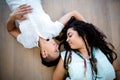 Lesbian couple lying on wooden floor Royalty Free Stock Photo