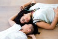 Lesbian couple lying on wooden floor Royalty Free Stock Photo