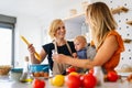 Lesbian mothers with adopted child. Happy homosexual family playing with her daughter Royalty Free Stock Photo